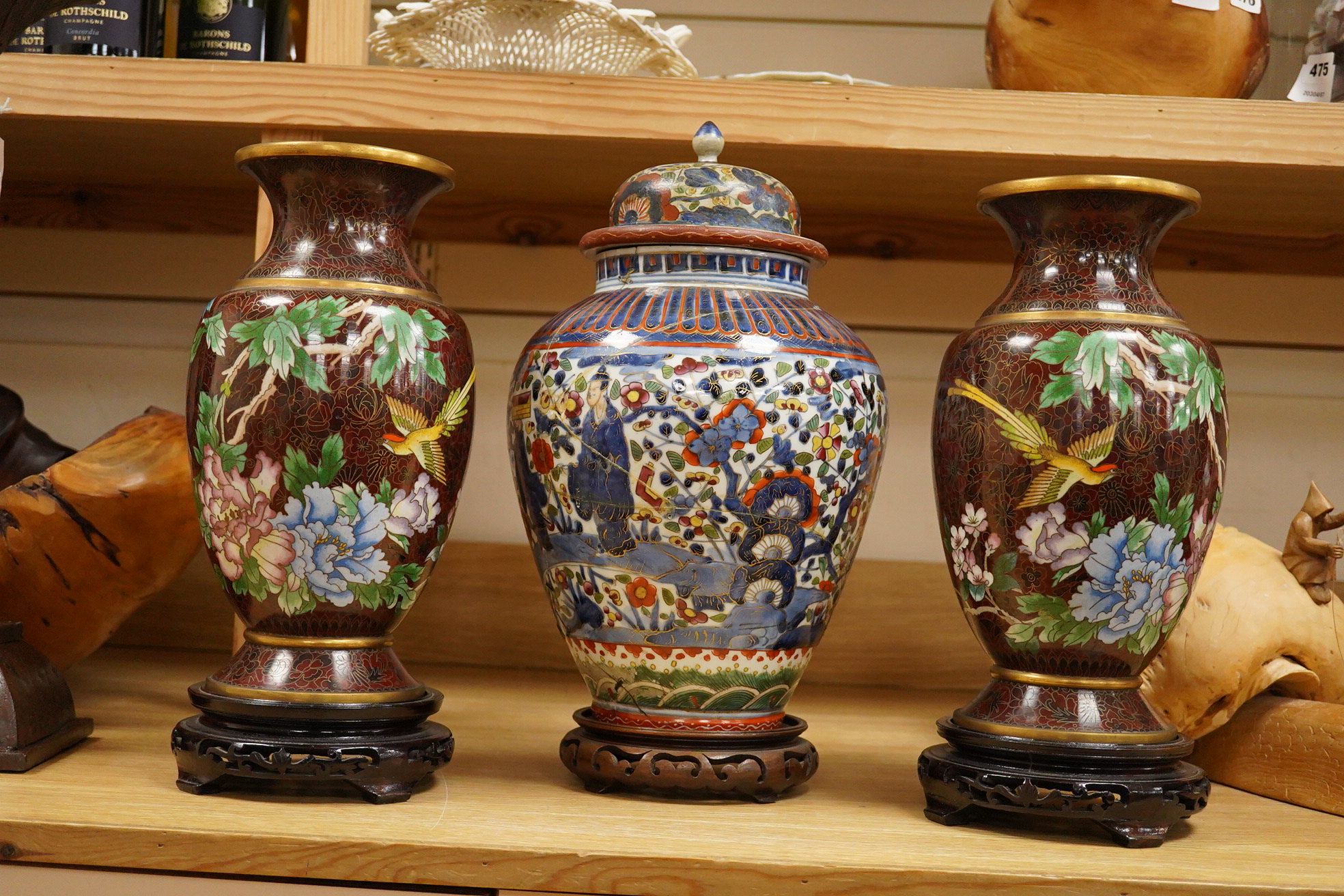 A pair of cloisonné vases on stands and Chinese clobbered vase and cover on stand (damaged). 44cm high